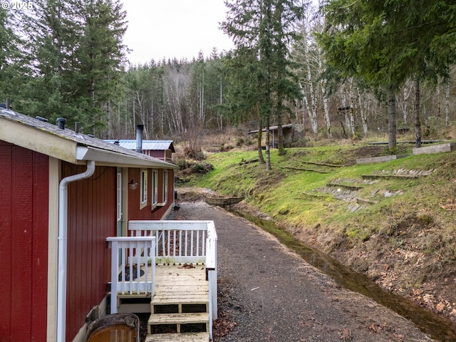 view of yard featuring a wooden deck