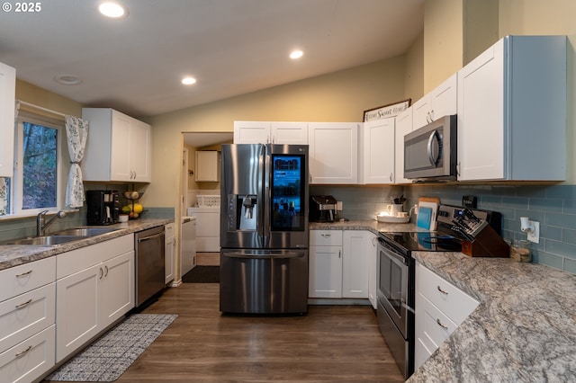 kitchen featuring sink, stainless steel appliances, white cabinetry, and light stone countertops