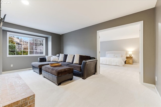 carpeted living room featuring baseboards