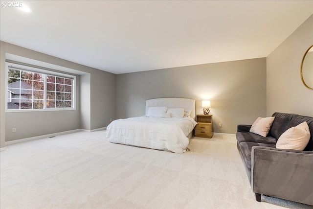 bedroom with baseboards and carpet floors