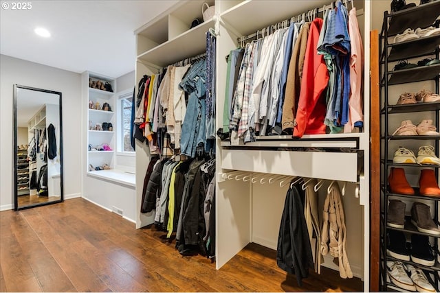 spacious closet with wood finished floors