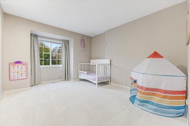 carpeted bedroom featuring baseboards