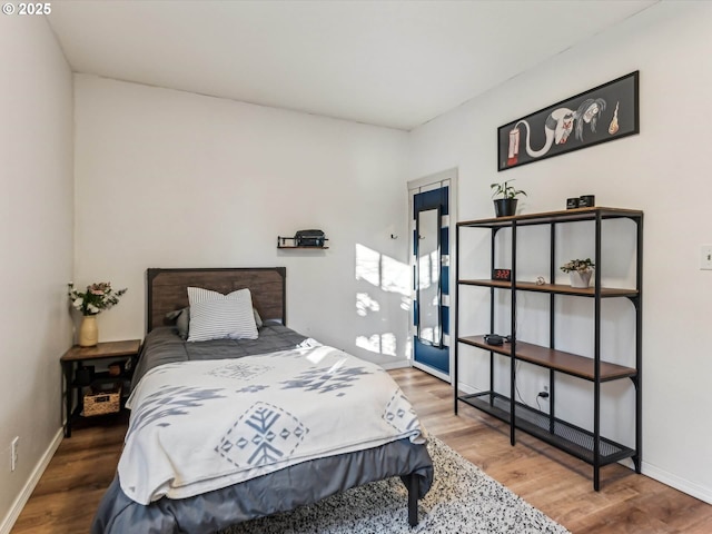 bedroom with hardwood / wood-style floors