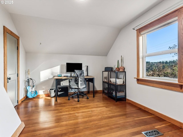 office area featuring lofted ceiling and light hardwood / wood-style flooring