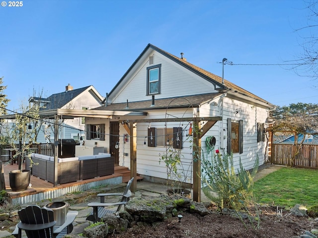 back of property with an outdoor living space