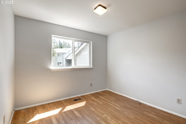 15000 SW Farmington Rd Unit 51, Beaverton, OR 97007 - empty room with wood finished floors and baseboards
