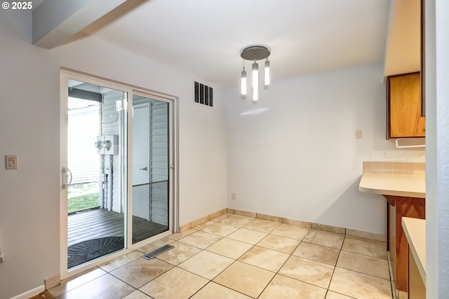 15000 SW Farmington Rd Unit 51, Beaverton, OR 97007 - unfurnished dining area featuring light tile patterned floors and baseboards