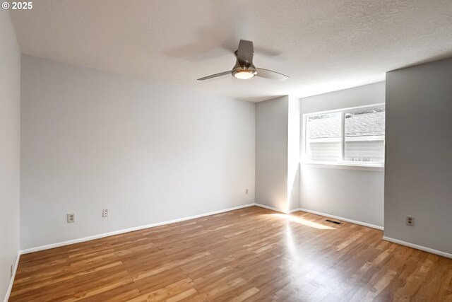 15000 SW Farmington Rd Unit 51, Beaverton, OR 97007 - spare room featuring wood finished floors, ceiling fan, and baseboards