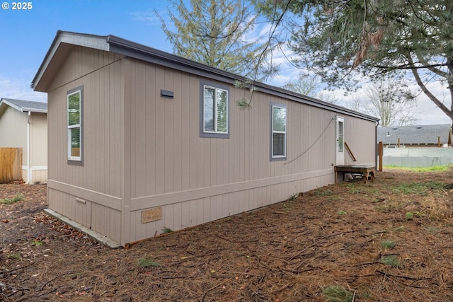 view of side of property with crawl space