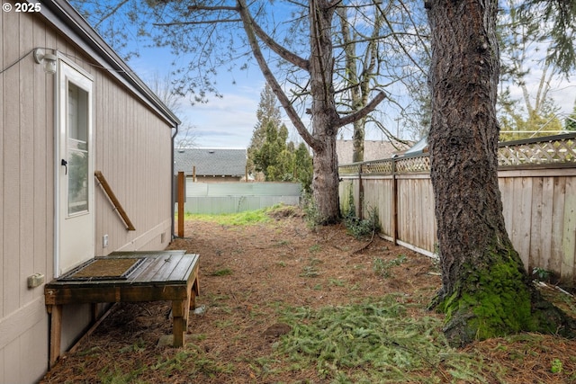 view of yard with a fenced backyard