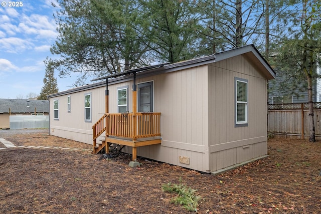 exterior space featuring crawl space and fence