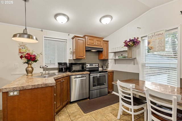 kitchen featuring brown cabinets, stainless steel appliances, under cabinet range hood, pendant lighting, and a sink