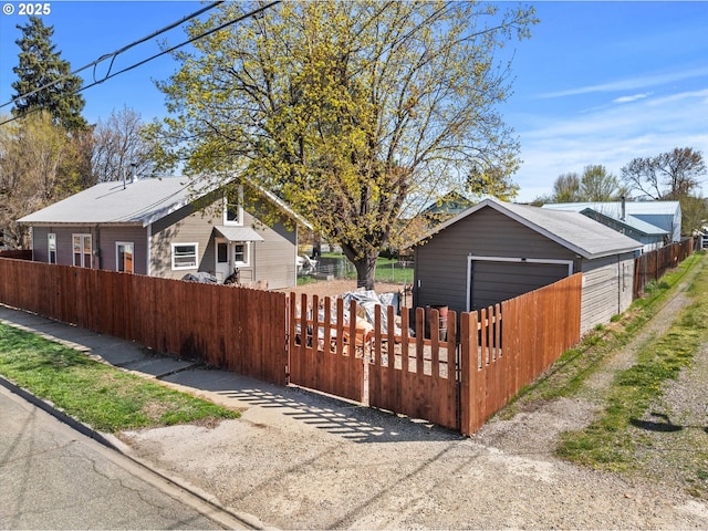view of home's exterior featuring a garage and a fenced front yard