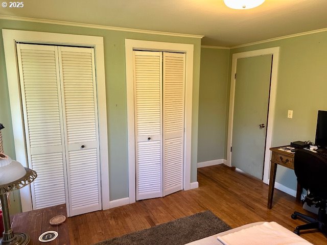 home office with crown molding, baseboards, and wood finished floors