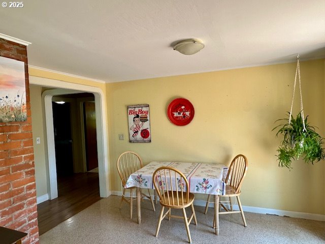 dining room featuring baseboards