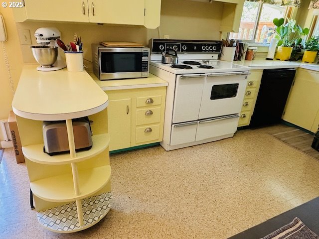 kitchen with stainless steel microwave, light countertops, white range with electric stovetop, and open shelves