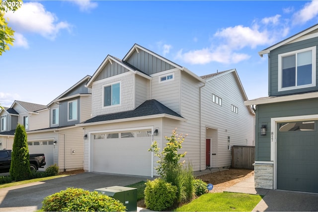 825 S 23rd Ave, Cornelius, OR 97113 - view of front of property featuring board and batten siding, a garage, driveway, and a residential view