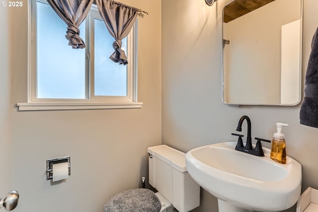 bathroom featuring toilet and sink