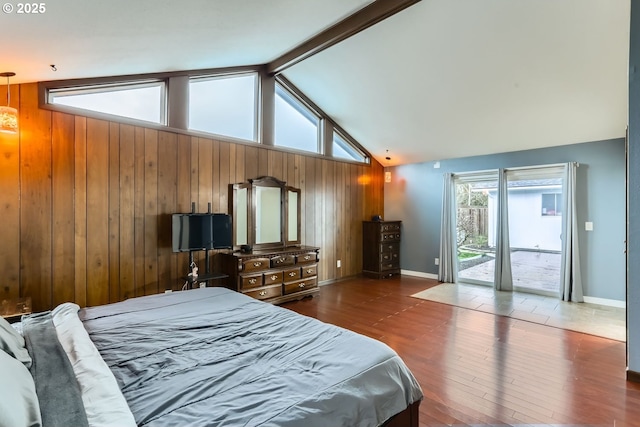 bedroom featuring vaulted ceiling with beams, wood walls, access to exterior, and dark wood-type flooring