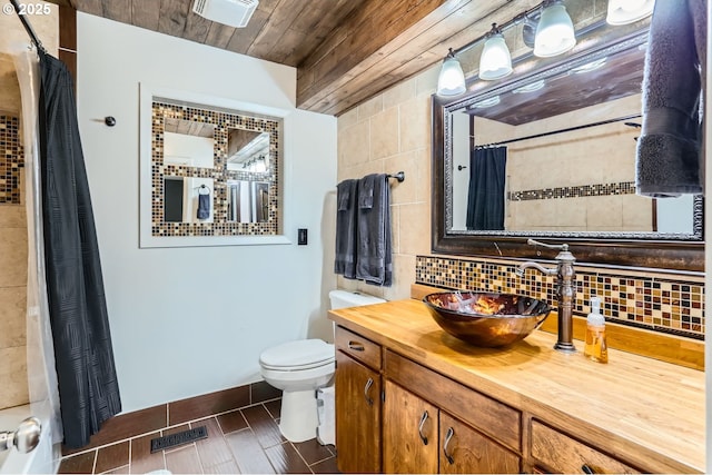 bathroom with vanity, wooden ceiling, a shower with shower curtain, toilet, and tasteful backsplash