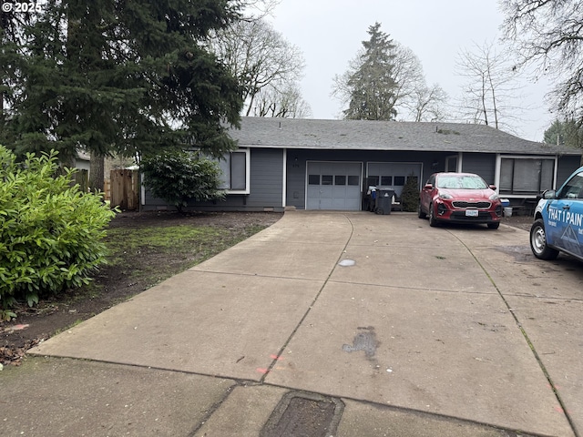 single story home with a garage