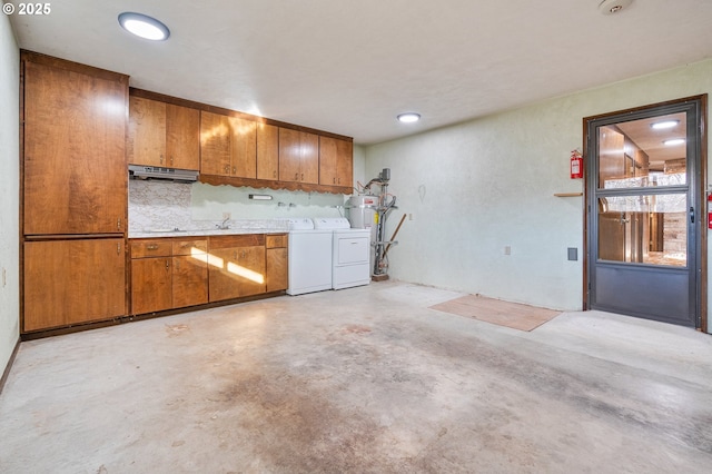 interior space featuring separate washer and dryer and backsplash