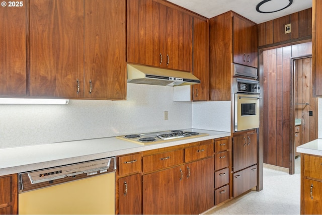 kitchen with white appliances and backsplash