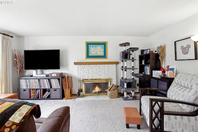 carpeted living area with a fireplace