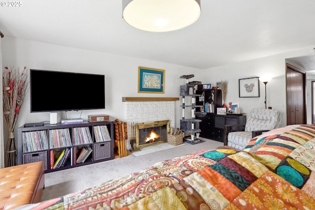 bedroom featuring carpet floors and a fireplace