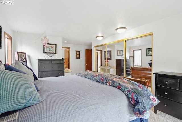 carpeted bedroom featuring a closet