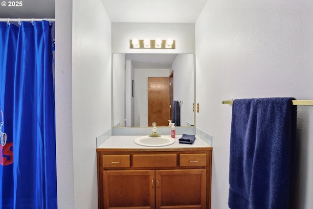 full bath with vanity and a shower with curtain