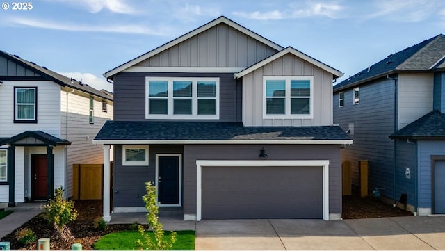 2891 V St, Springfield, OR 97477 - view of front of house featuring board and batten siding, concrete driveway, an attached garage, and roof with shingles