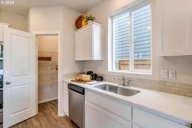 2891 V St, Springfield, OR 97477 - kitchen with stainless steel dishwasher, a sink, light countertops, and white cabinets