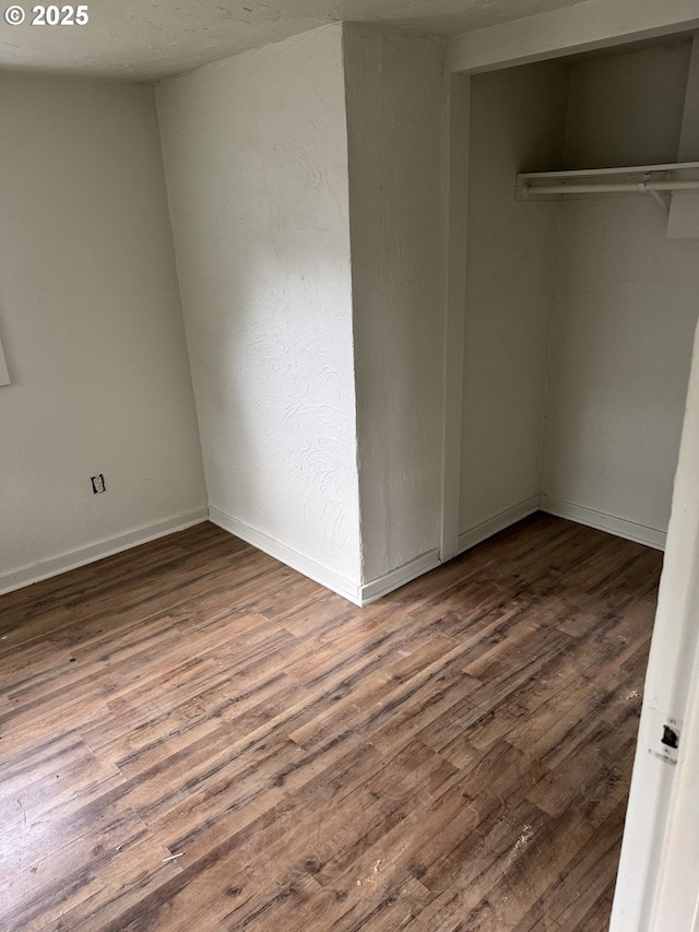 4545 Camellia St, Springfield, OR 97478 - unfurnished bedroom featuring a closet, wood finished floors, and baseboards