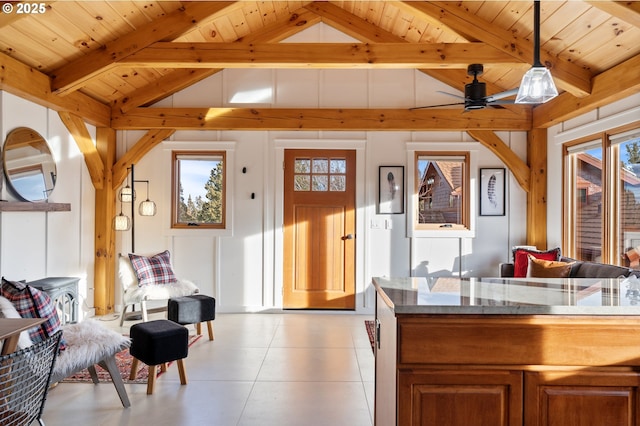 67775 Cloverdale Rd, Sisters, OR 97759 - living area featuring wood ceiling, a ceiling fan, and a decorative wall