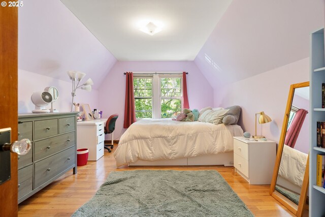 2406 SE 30th Ave, Portland, OR 97214 - bedroom with lofted ceiling and light wood-style flooring