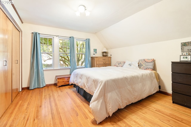 2406 SE 30th Ave, Portland, OR 97214 - bedroom featuring light wood-type flooring, vaulted ceiling, and a closet
