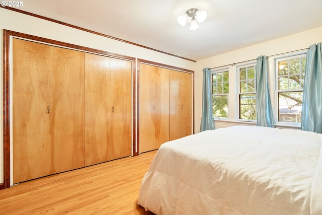 2406 SE 30th Ave, Portland, OR 97214 - bedroom featuring two closets and light wood-type flooring