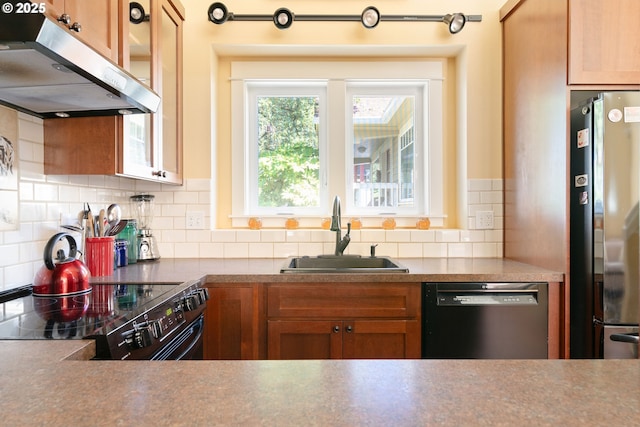 2406 SE 30th Ave, Portland, OR 97214 - kitchen with dishwasher, under cabinet range hood, electric range, freestanding refrigerator, and decorative backsplash