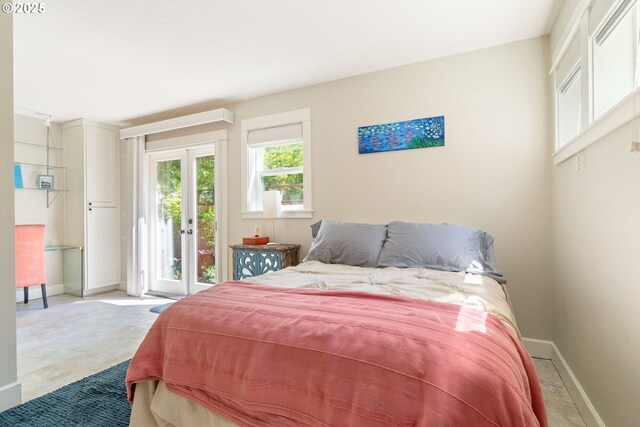 2406 SE 30th Ave, Portland, OR 97214 - bedroom with access to outside, french doors, and light colored carpet