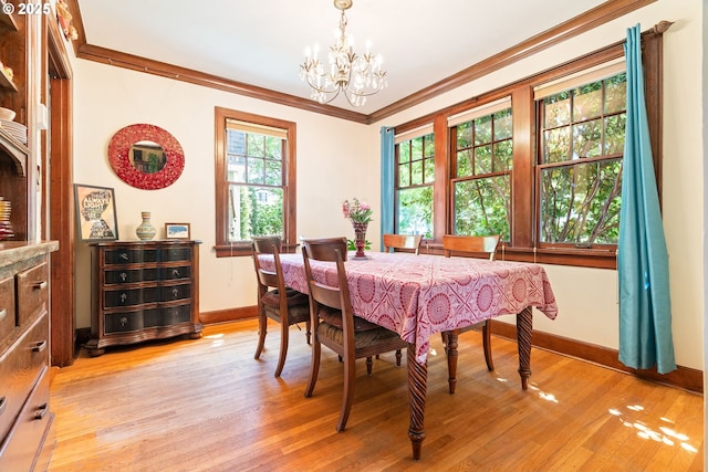 2406 SE 30th Ave, Portland, OR 97214 - dining space featuring a chandelier, light wood-style flooring, and crown molding