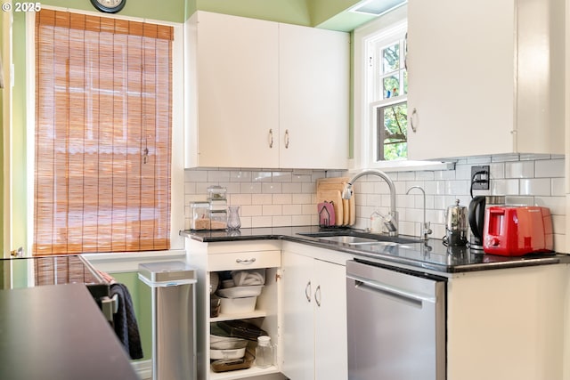 2406 SE 30th Ave, Portland, OR 97214 - kitchen with dishwasher, dark countertops, white cabinets, and tasteful backsplash
