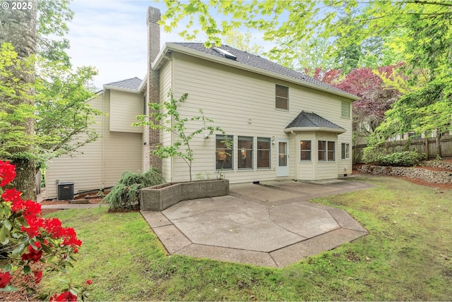 13460 Snowberry Ct, Lake Oswego, OR 97035 - back of house featuring a chimney, a patio, and central AC