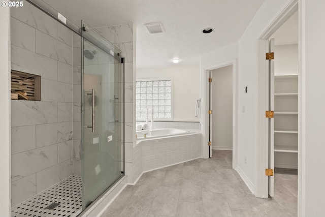 13460 Snowberry Ct, Lake Oswego, OR 97035 - bathroom featuring a bath, a shower stall, a spacious closet, and tile patterned flooring