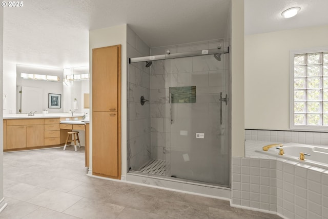 13460 Snowberry Ct, Lake Oswego, OR 97035 - bathroom with vanity, a shower stall, a bath, a textured ceiling, and tile patterned floors