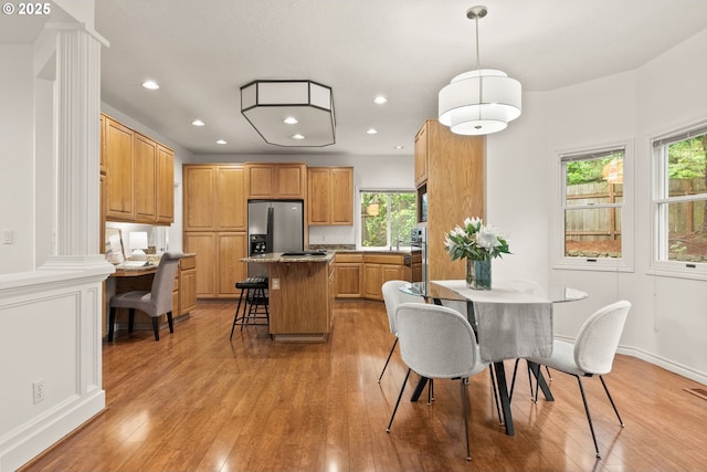 13460 Snowberry Ct, Lake Oswego, OR 97035 - dining area with light wood-type flooring, healthy amount of natural light, and recessed lighting