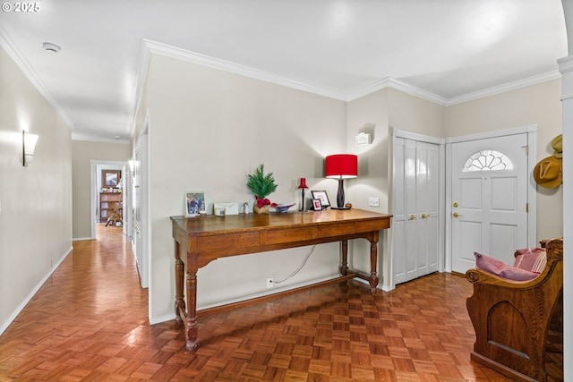 foyer entrance with ornamental molding and baseboards