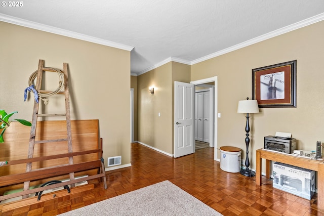 home office with baseboards, crown molding, and visible vents