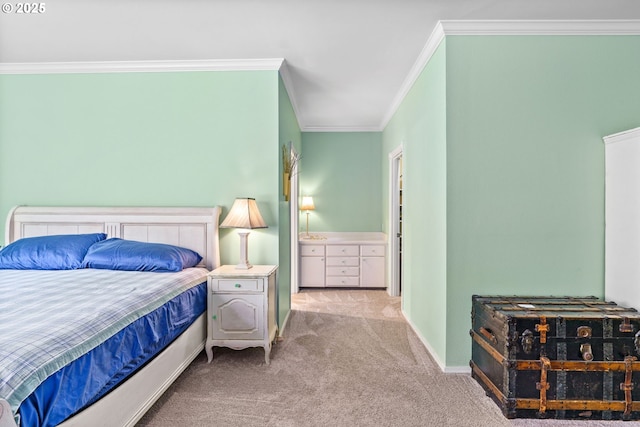 bedroom with crown molding, baseboards, and carpet floors