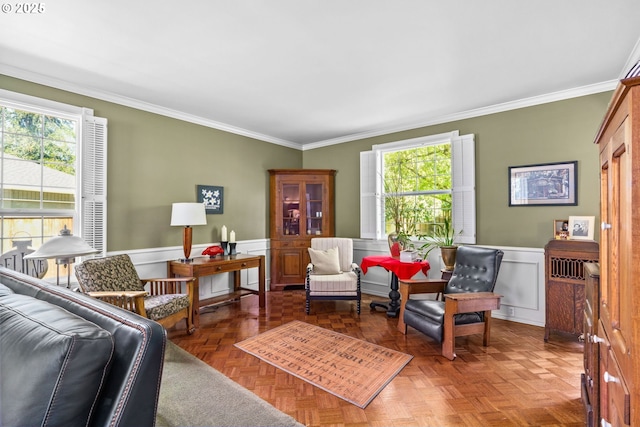 living room with wainscoting and crown molding